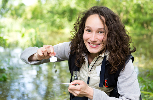 young woman taking water samples